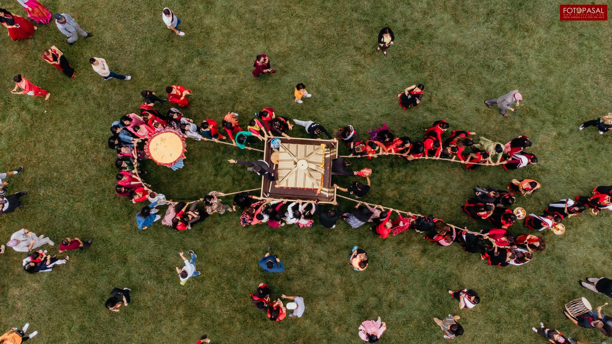 Aerial view of the community pulling the sacred chariot during the Rath Jatra procession
