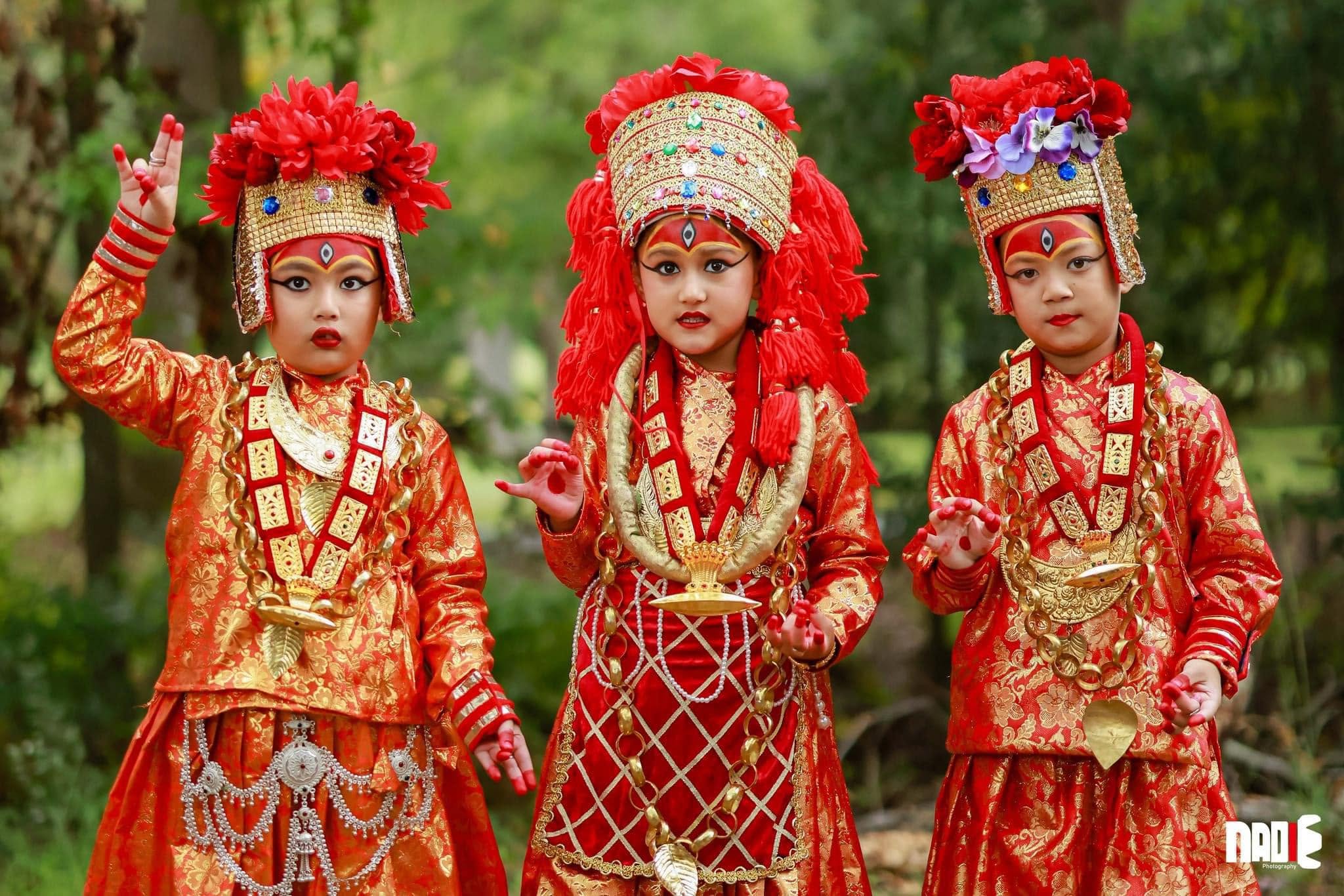 Three children in traditional Newah ethnic dress and headpieces